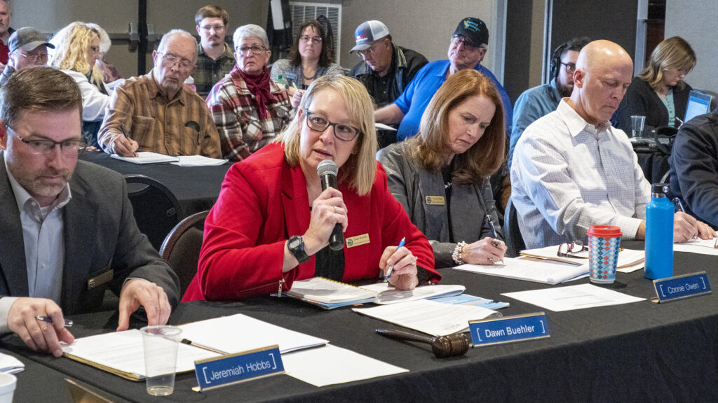 Kansas Water Authority members appear at a table during a meeting