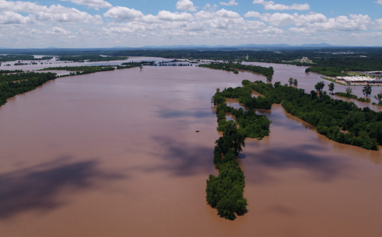 Record flooding causes levee breach in western Arkansas | PBS NewsHour